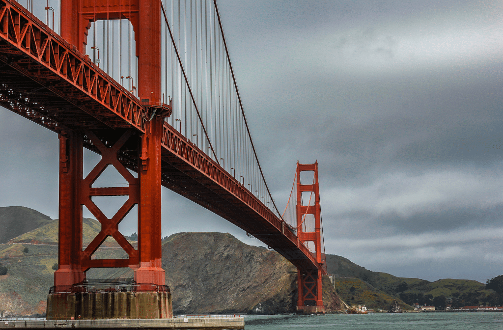 A picture of the Golden Gate Bridge in San Francisco from underneath. 