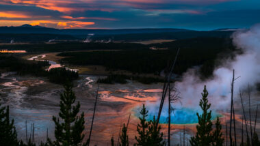 A sunset over Grand Prism spring is colorful and a sight worth seeing in Yellowstone.
