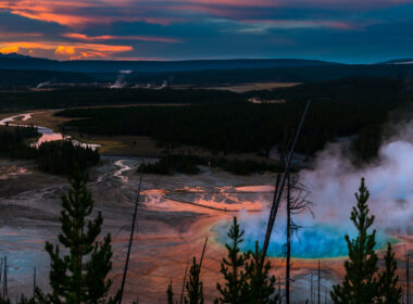 A sunset over Grand Prism spring is colorful and a sight worth seeing in Yellowstone.