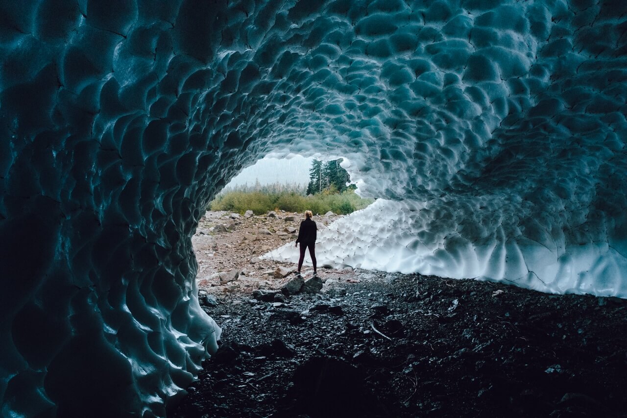 Man standing inside big four ice caves