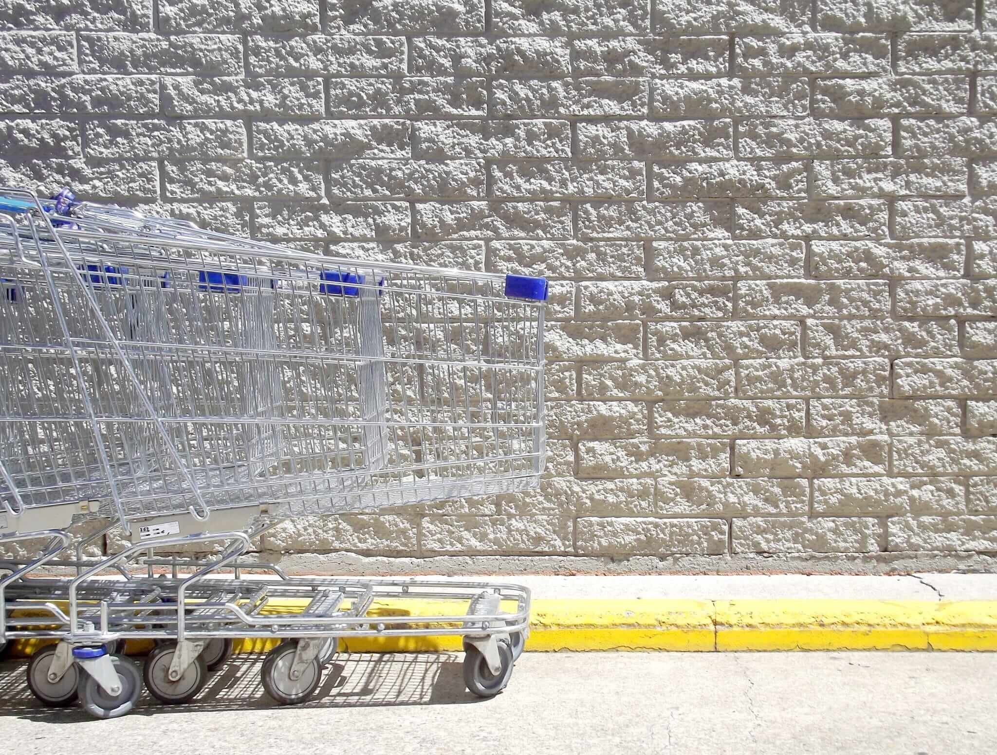 Shopping carts lined up in a Walmart parking lot 