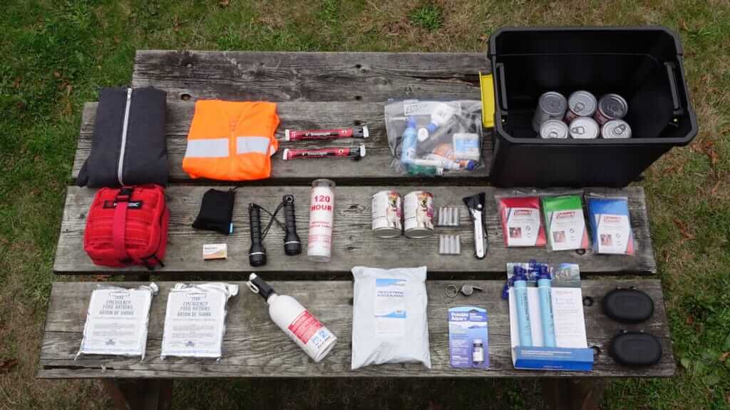 An RV emergency kit laid out on a picnic table to show all of the items inside. A great RV safety tool to have. 