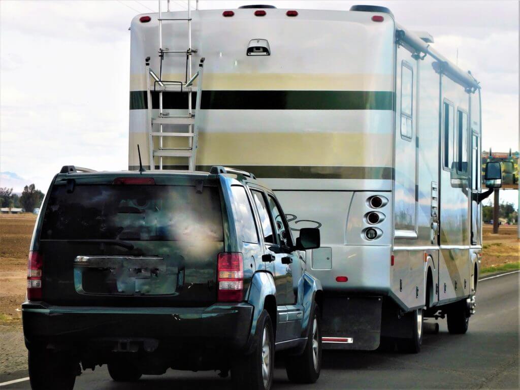 Class A Motorhome towing a vehicle