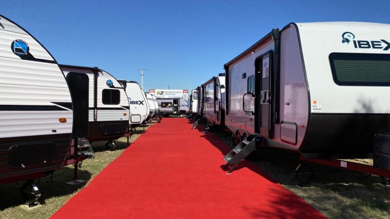 a row of RVs at a show