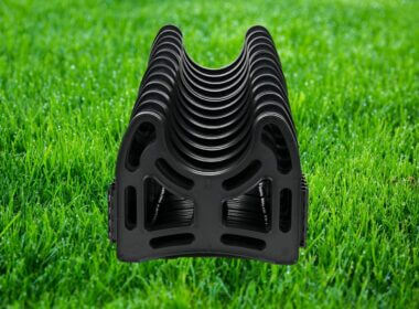 RV sewer hose support sitting on a field of grass