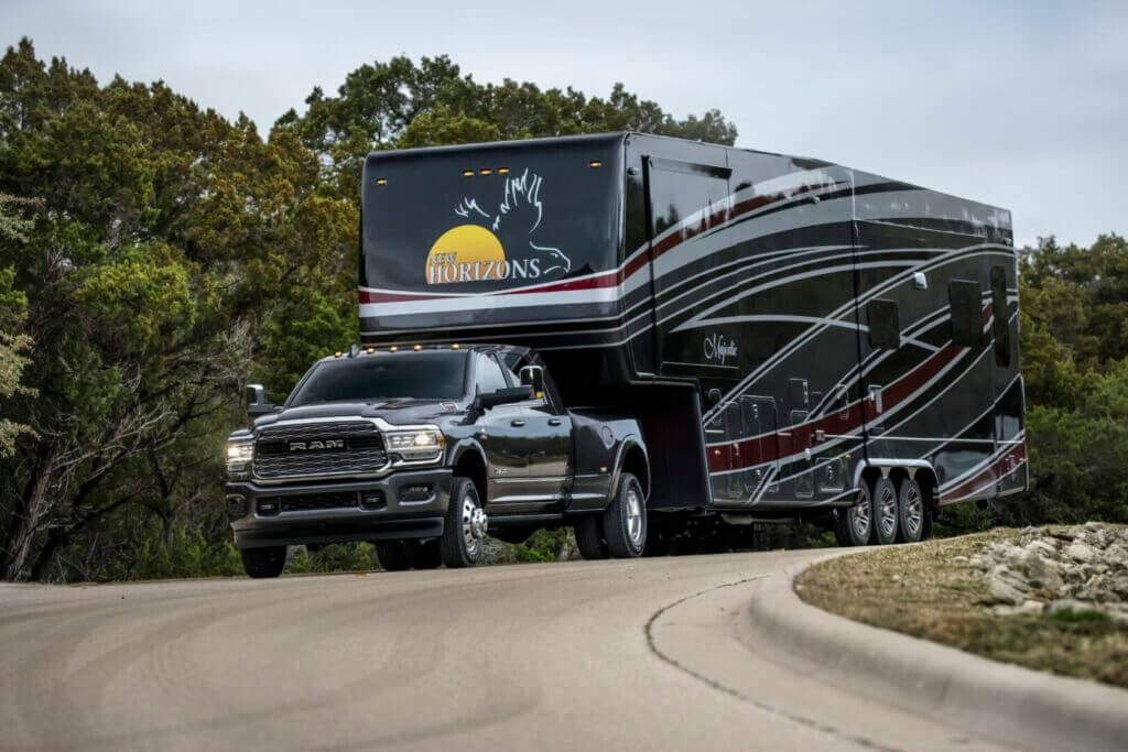 2021 Ram 3500 Heavy Duty Limited Crew Cab Dually towing a large RV.