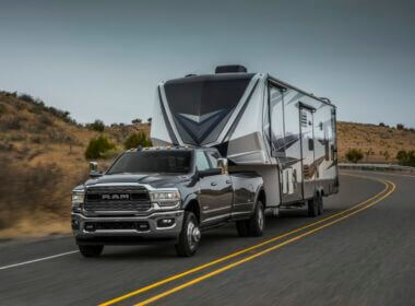 Ram 3500 vs Ram 2500, which one is better for towing your RV? This picture is a Ram 3500 towing a fifth wheel down a desert highway.