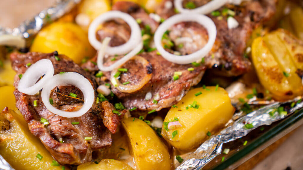 An easy foil packet lunch is steak, potatoes, onions, and cheese!
