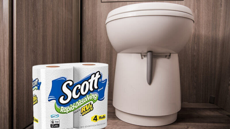 An RV toilet with Scott RV toilet paper alongside it.