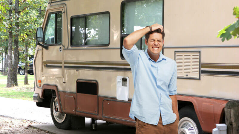 A man stands in front of his RV and feels the pain of his thousand trails membership regrets