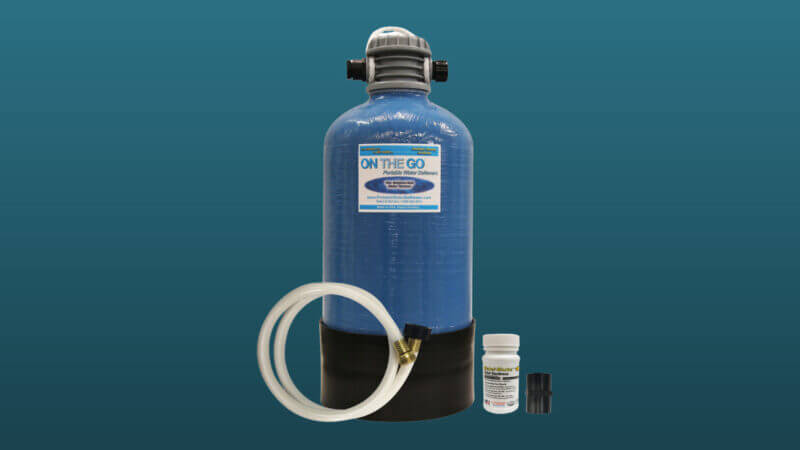 An on the go water softener set against a blue background