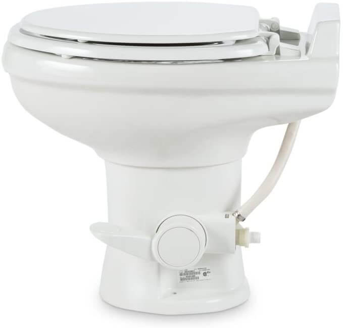 Side view of a Dometic 320 RV toilet showing the foot petal you use to flush it