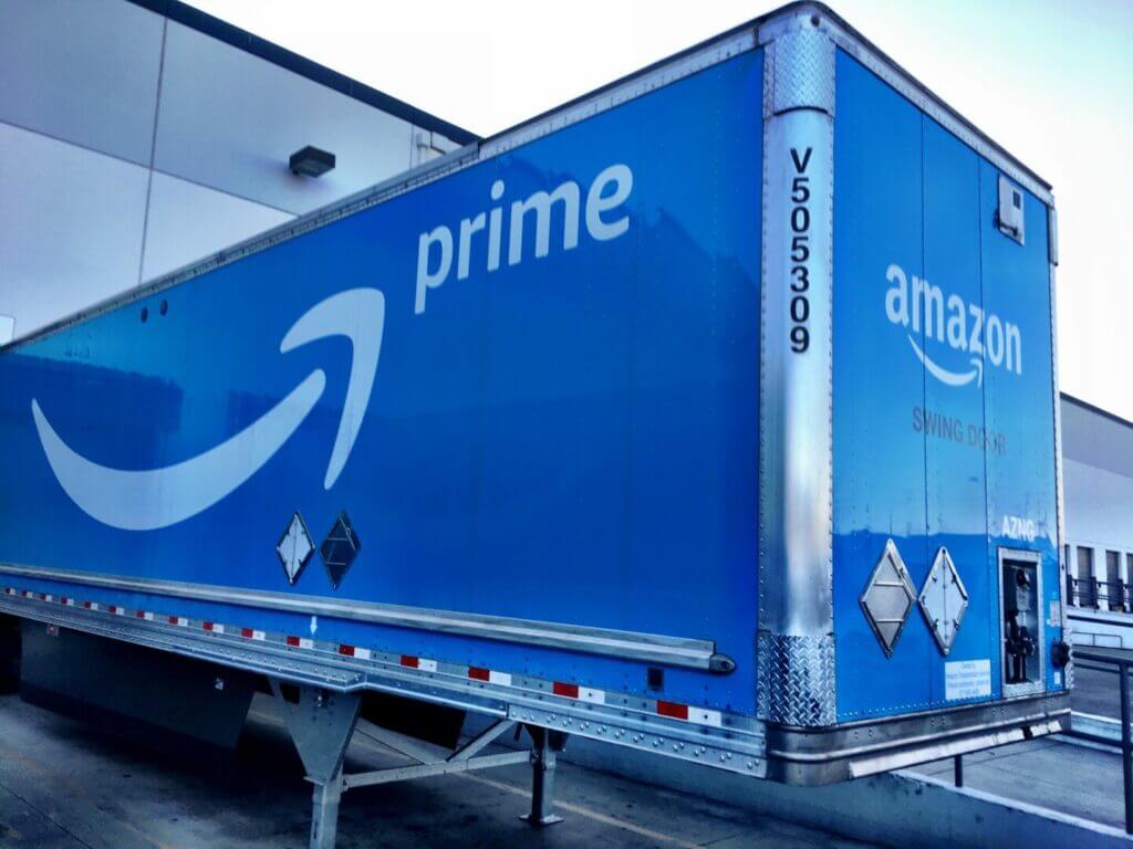 Blue semi truck with Amazon Prime written on the side 
