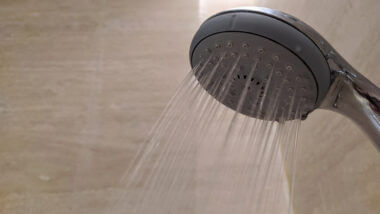 A shower head in an RV relies on a water pump to have steady strong water pressure.