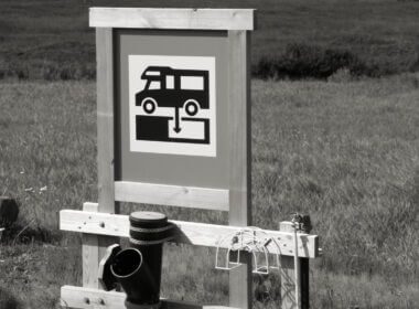 A black and white dump station sign and there are lots of resources to help you find a dump station for free!