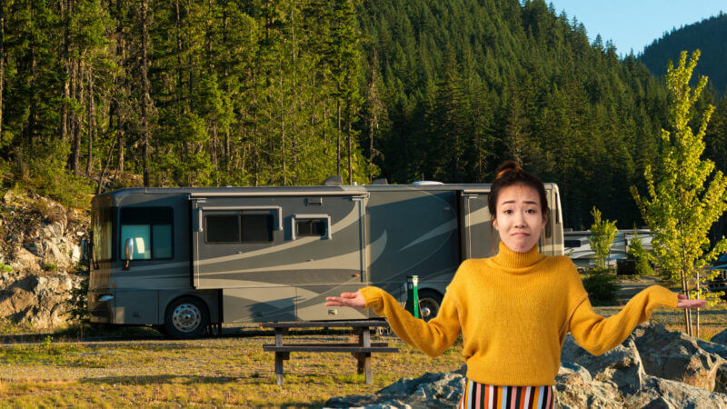 A woman stands in front of her RV with confusion because she made some common RV setup mistakes.