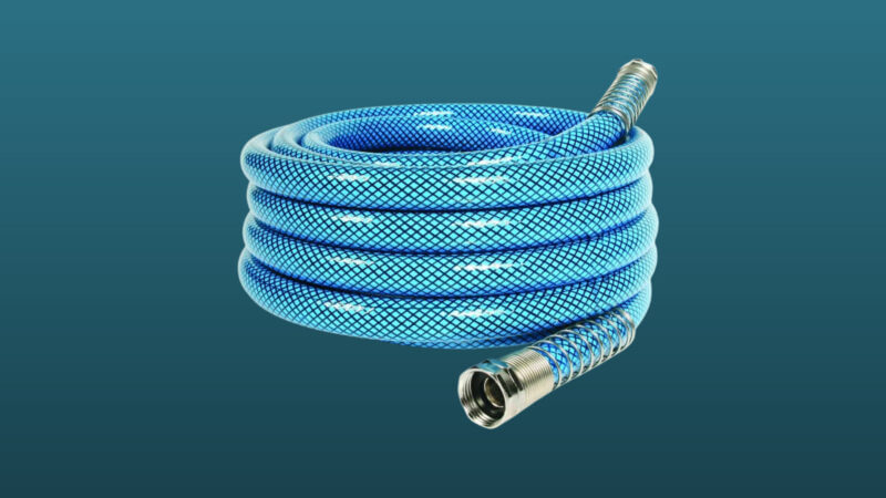A camco water hose set against a dark blue background.
