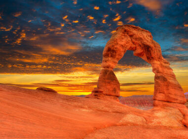 Arches national park glow orange in the sunset light and it's a sight you can see if you plan an RV trip to Utah.