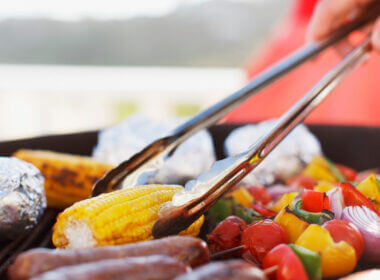 Someone is flipping veggies on a grill but which is better? Green mountain grills vs Traeger?