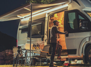 A man steps into a lit Class B RV which could be a great RV to live in full time.