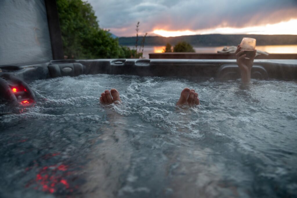 Friends on vacation enjoying a hot tub.