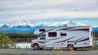 An RV is parked and ready to camp near Mammoth Lakes with the mountains looming in the background.