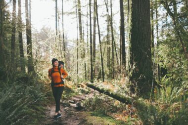 Woman walking through National Park forest.