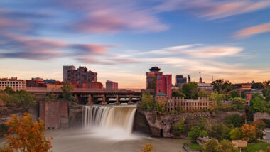 A colorful sunset over High Falls and the Rochester NY skyline.
