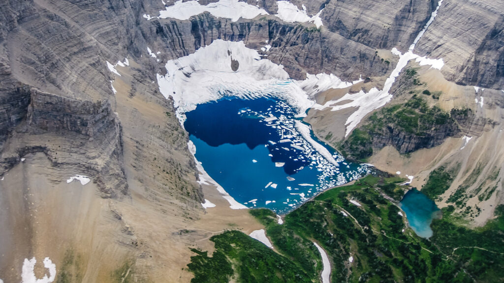 The Grinnell glacier is a bright blue glacier that can be accessed by hiking the Highline Trail.