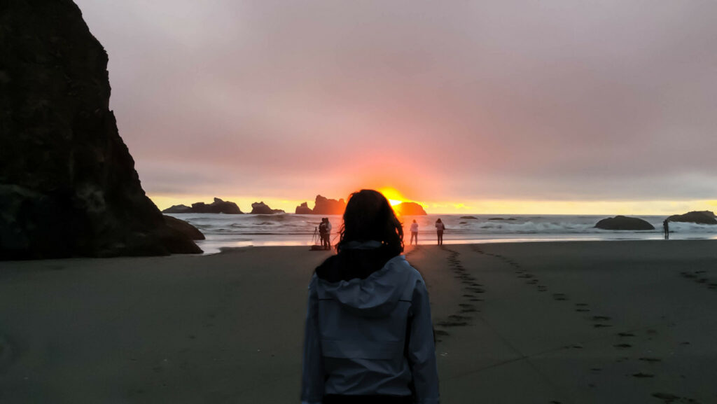 Friends on Oregon coast at sunset