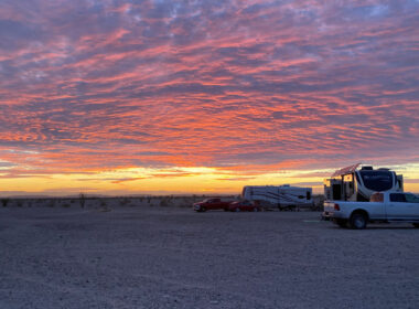 A few RVs enjoy a beautiful sunset and privacy by free camping in Arizona.