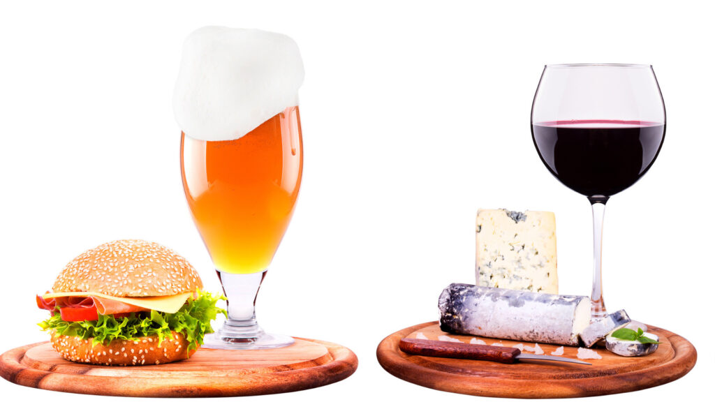 A beer and sandwich vs a glass of wine with cheese.