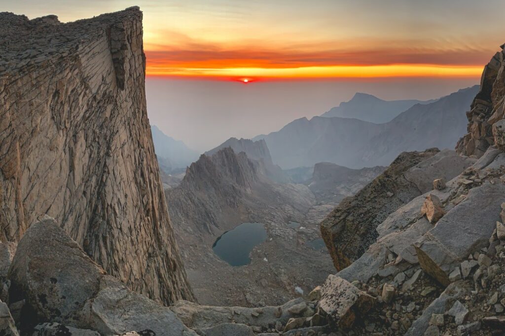 A smokey sunrise from Mount Whitney, California in the Inyo National Forest.