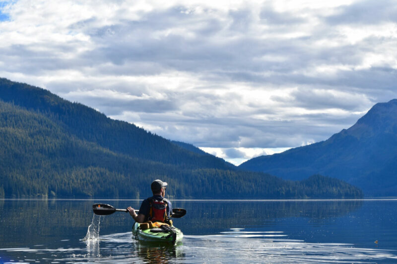 A kayaker on the ocean in between Windfall and Admiralty Islands in the Tongass National Forest in Alaska