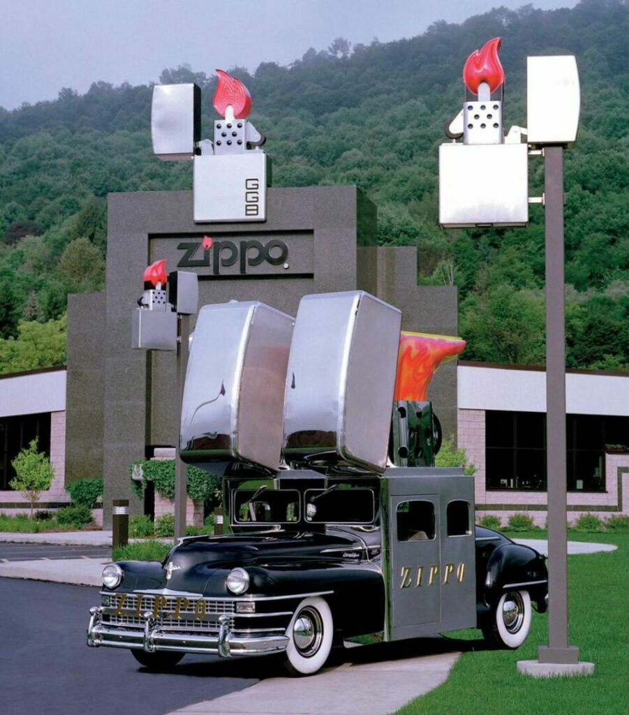The outside of the Zippo/Case Museum features a classic car decked out with two large zippo lighters opening from the roof.