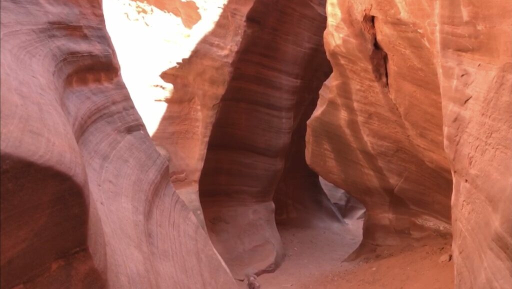 Red canyon walls glow with the southwest desert sun in the Grand Staircase-Escalante National Monument.