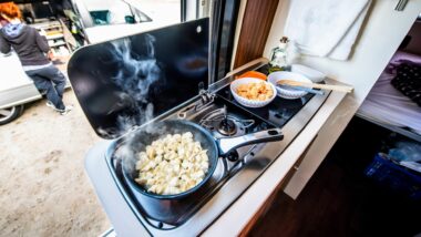 Breakfast food cooking on a gas RV stove