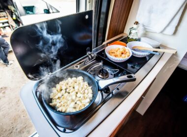 Breakfast food cooking on a gas RV stove