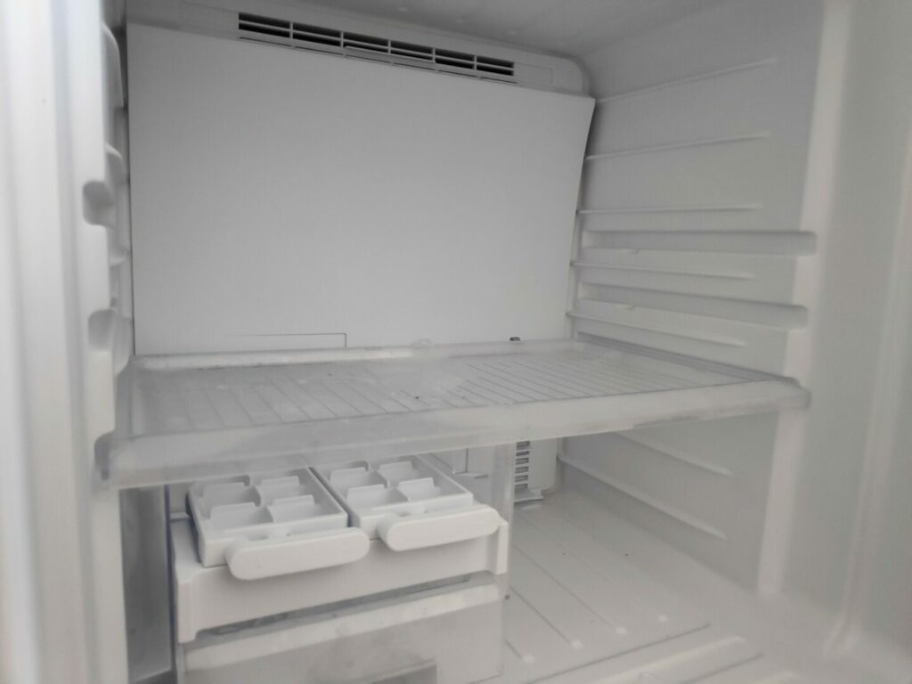 Inside defrosted refrigerator.