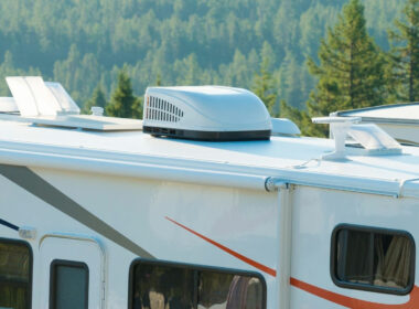 A rooftop RV air conditioner on a motorhome out in the wilderness.