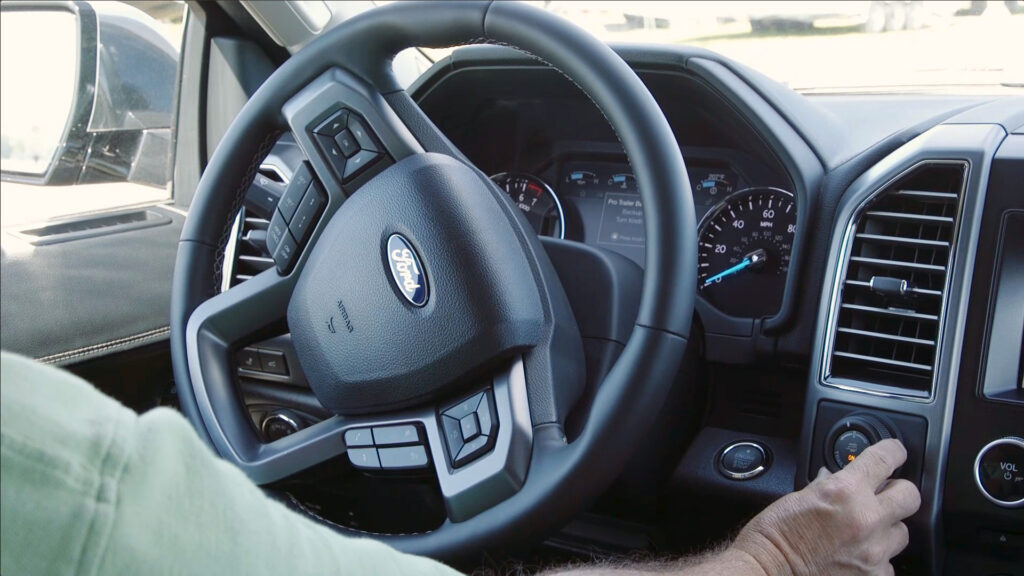 Driver of a Ford vehicle uses one of any features for towing via the dashboard.