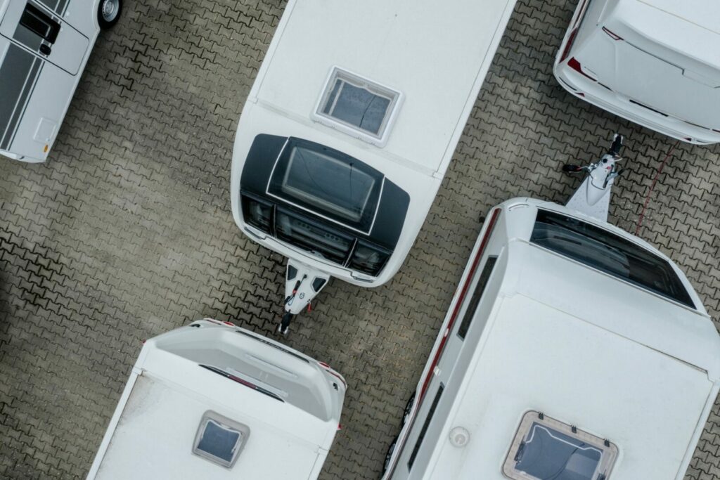 Aerial view of travel trailers in a parking lot at an RV dealership