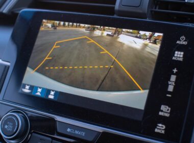 The rear view backup camera monitor in a vehicle has lines to assist in backing up.