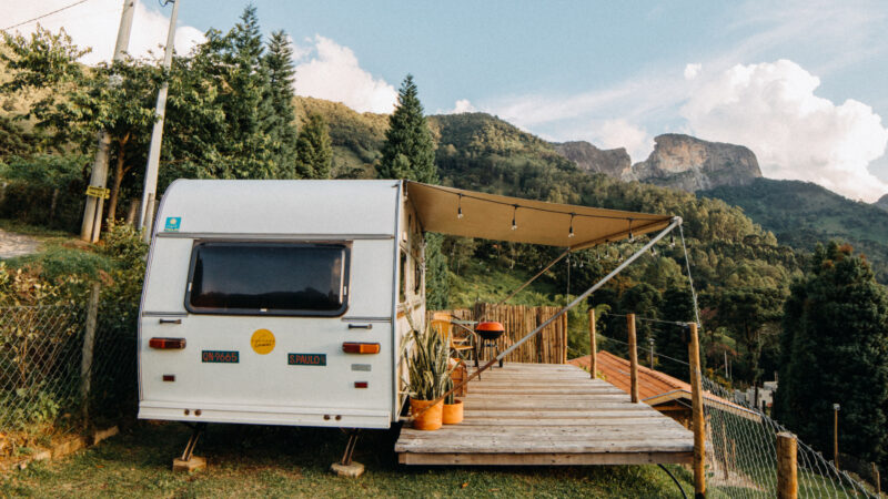 An RV is parked on private land to be used as a permanent living residence rather than living in a traditional home.