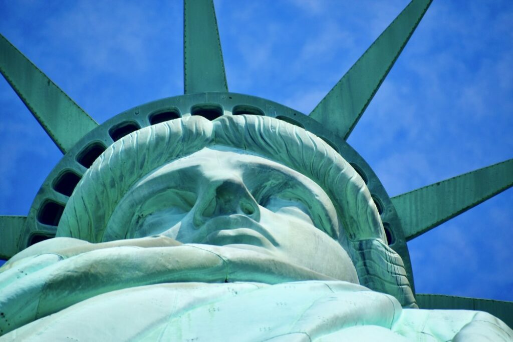 Close up of Lady Liberty’s face on a summer day in New York City.