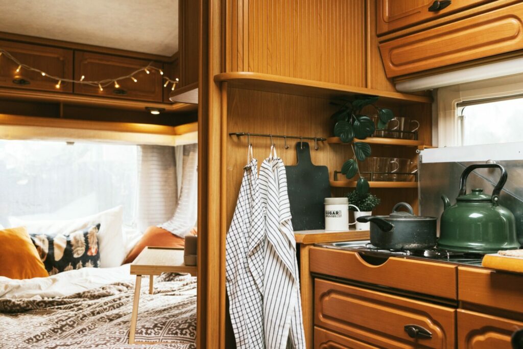 Organized RV kitchen and bedroom.