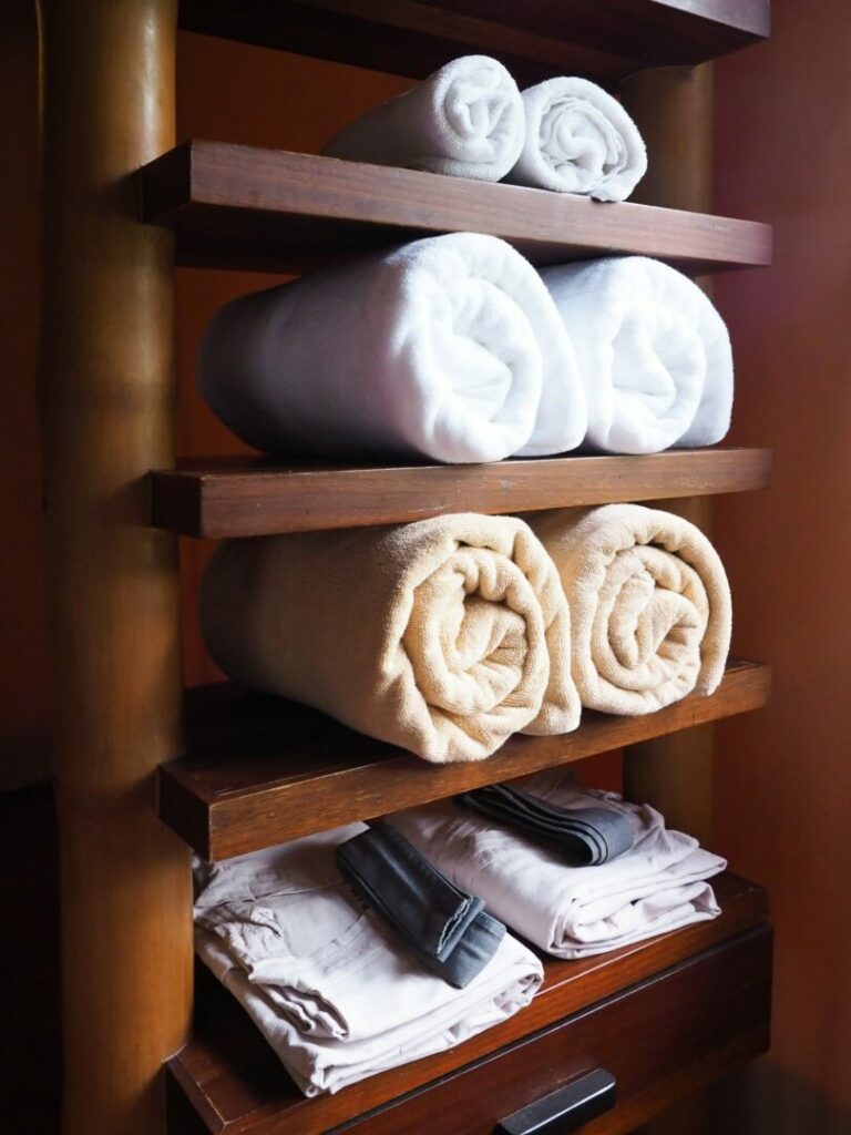Towels organized on shelving unit