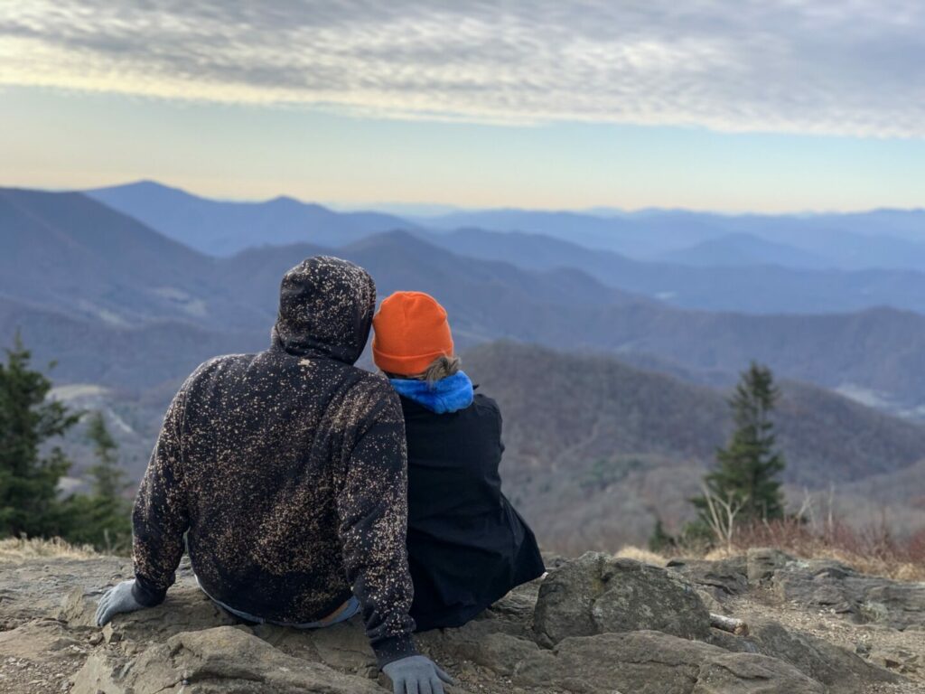Couple hiking and looking at the view in the Great Smoky Mountains.