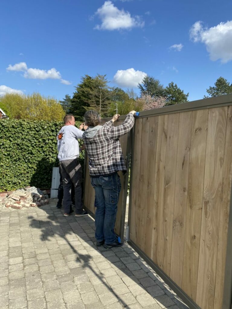 Men installing a front gate