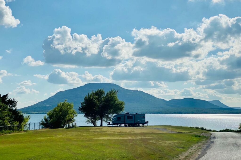 RV camping at a lake with a scenic view in Oklahoma.